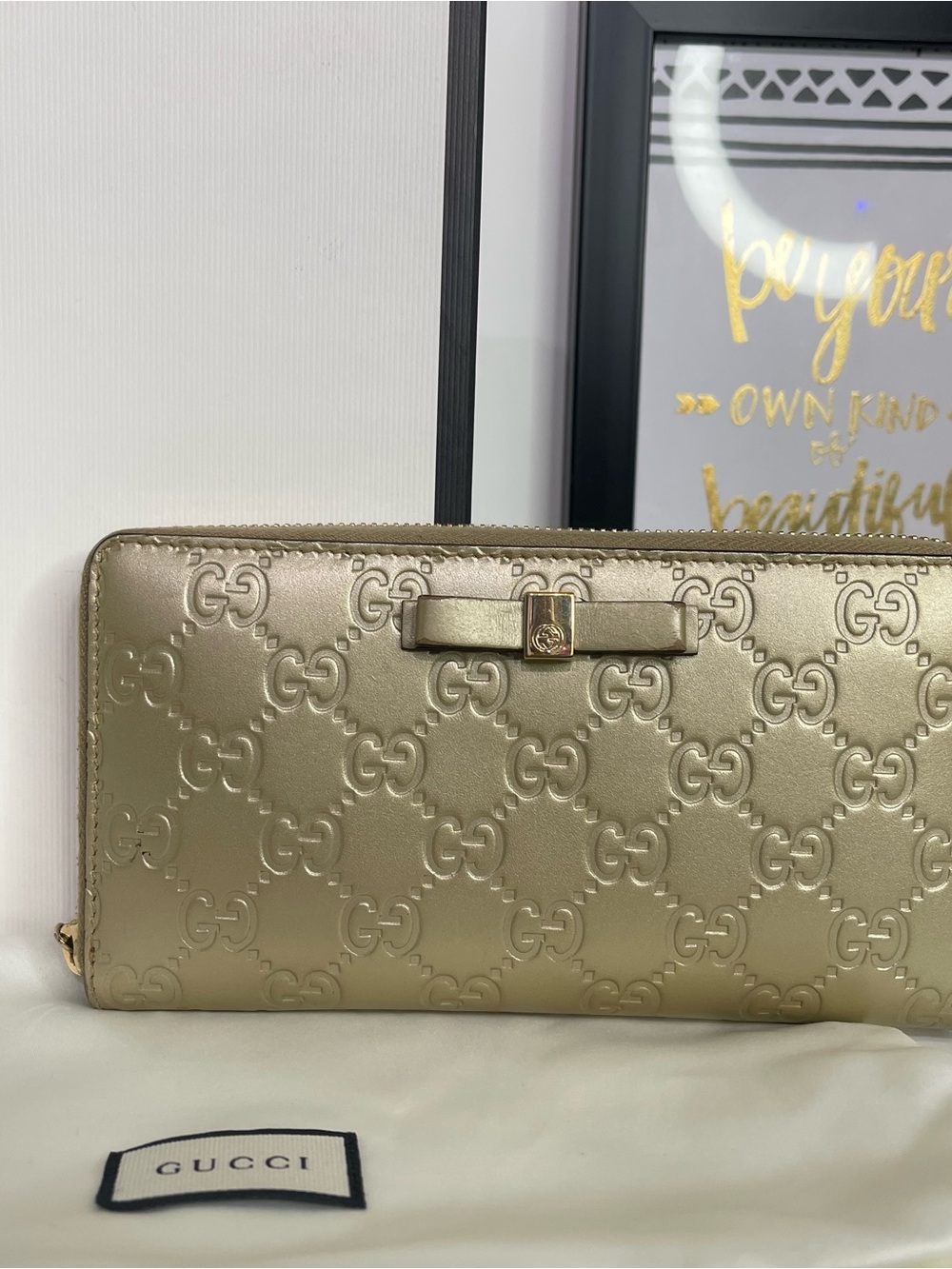 Gucci MetallicGold Embossed GG Bow Zip Wallet